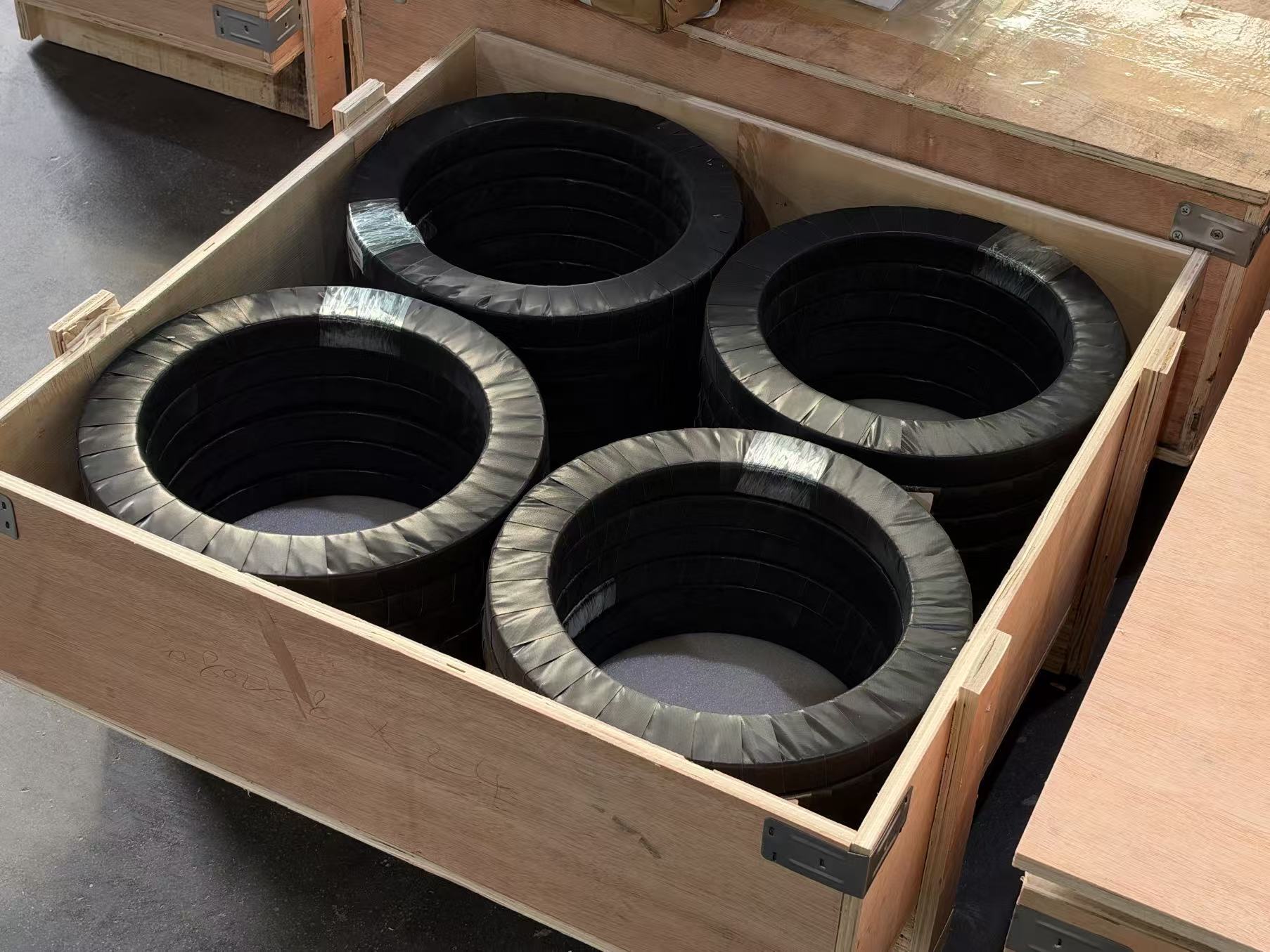 Crossed roller bearings wrapped in protective film and packed in a plywood export crate for shipment to Germany Crossed roller bearings wrapped in protective film and packed in a plywood export crate for shipment to Germany